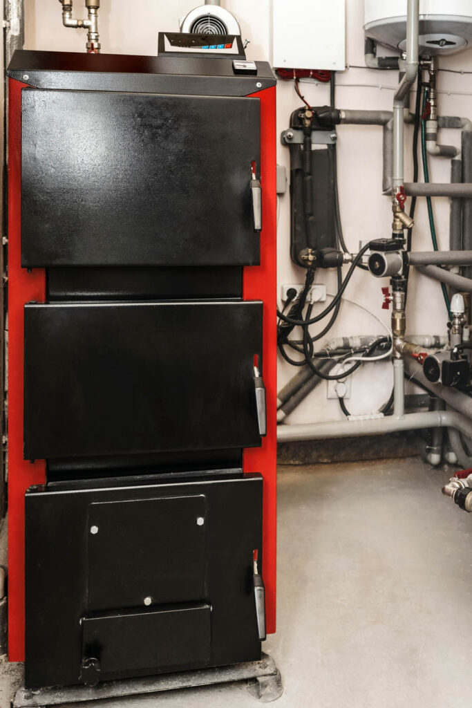 Solid-fuel Boiler with Heating System Equipment in Boiler room.